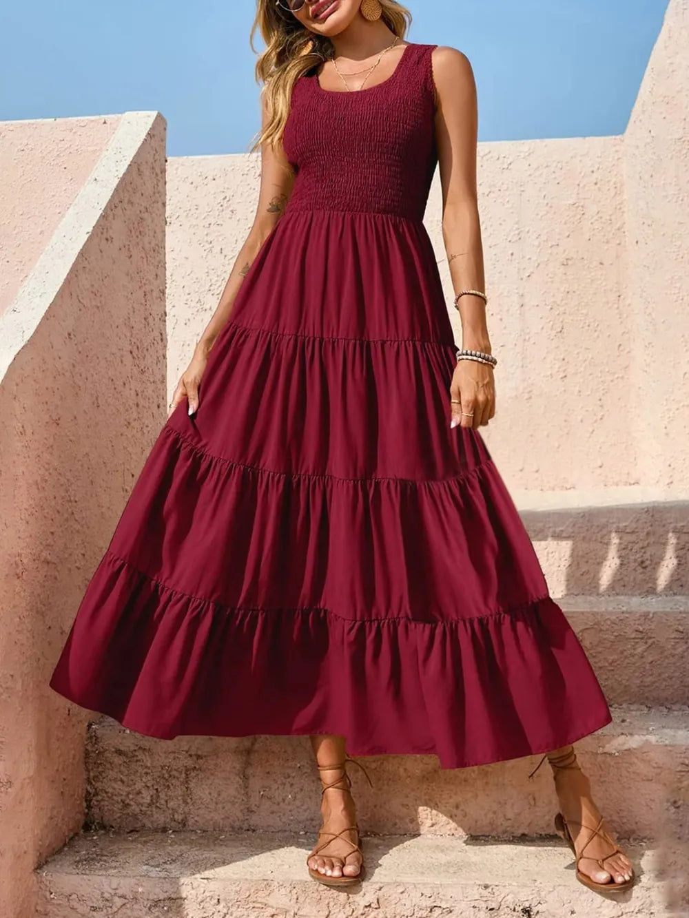 Burgundy tiered smocked wide-strap dress with round neckline and tiered ruffles