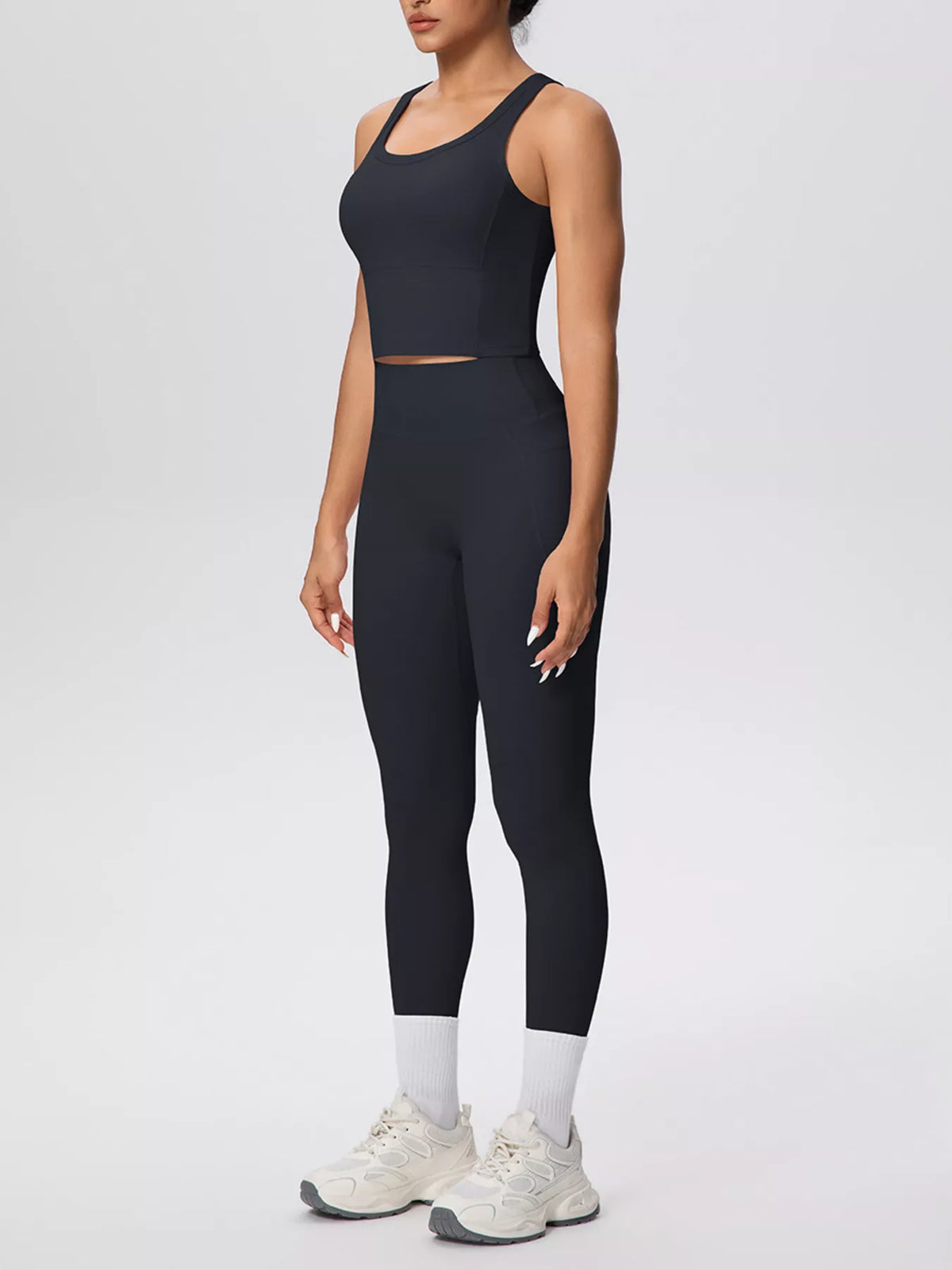 Black scoop-neck tank and high-waist leggings set with light ankle panels