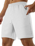 Men's textured drawstring casual shorts, white with elastic waistband and tassel ties.