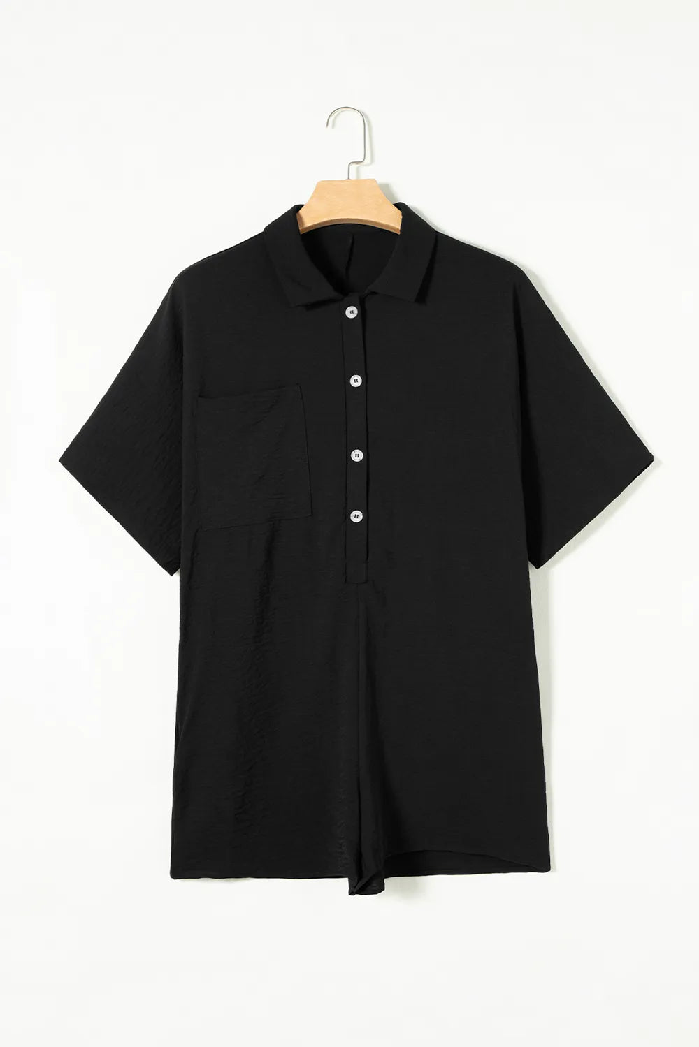 Black collared button romper on hanger with short sleeves and front placket
