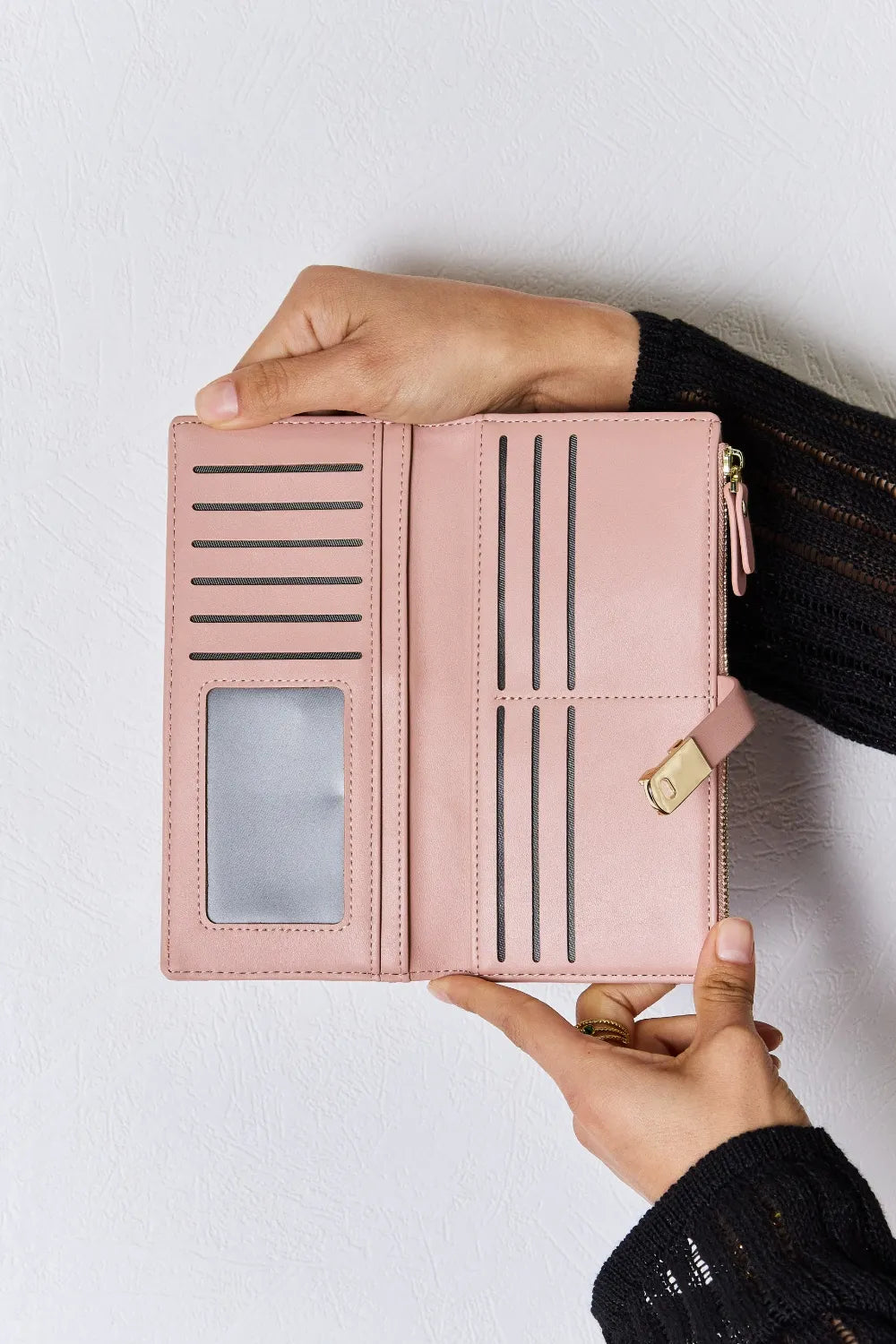 Pink PU leather wallet open showing card slots, center divider, and zip pocket.