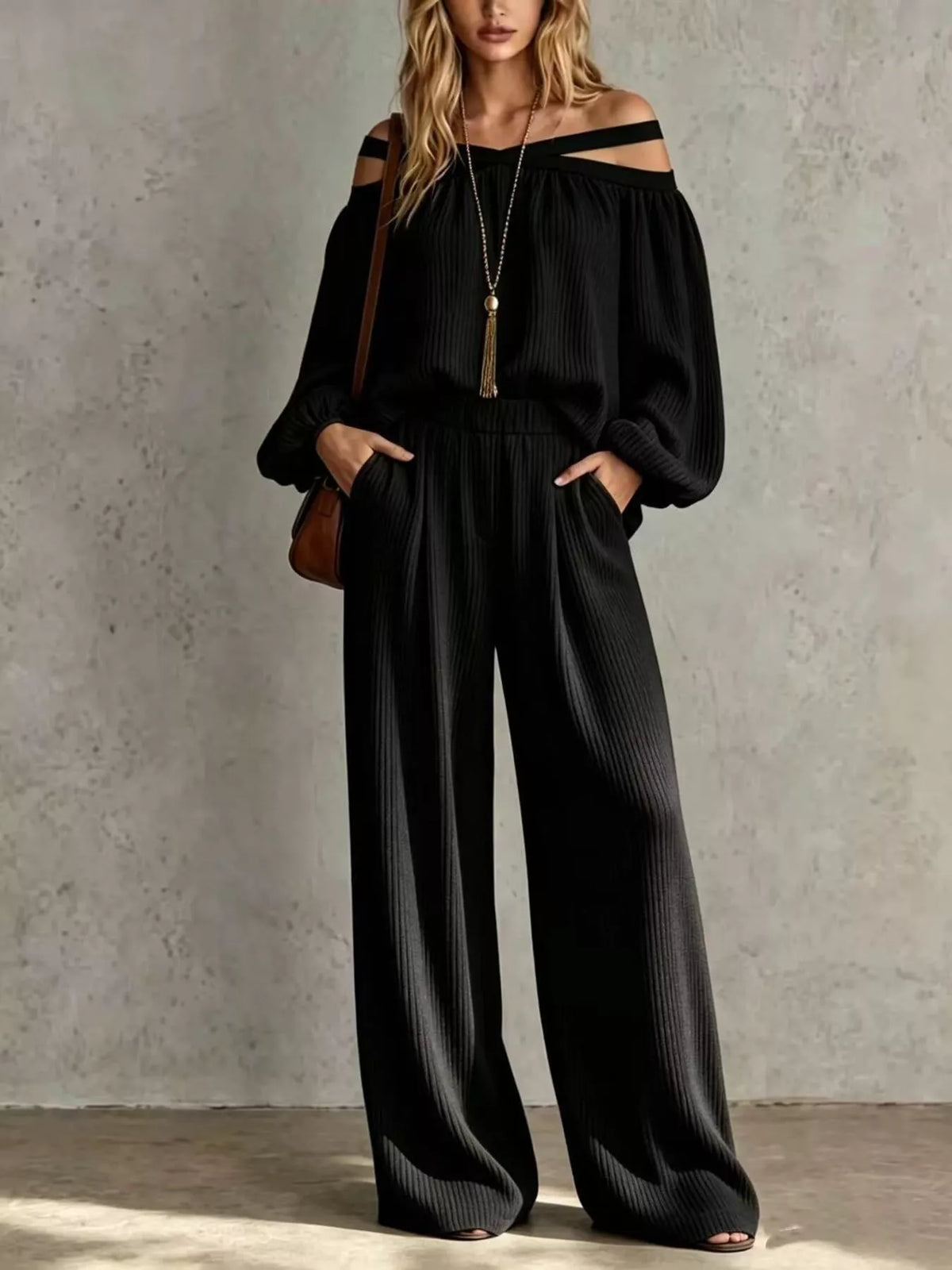 Black off-shoulder ribbed knit set with long sleeves and wide-leg pants