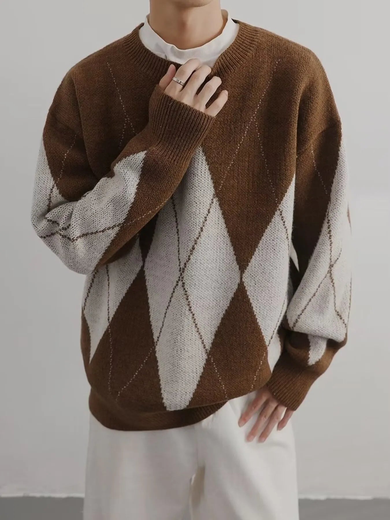 Brown and cream argyle oversized knit sweater with crew neck and ribbed cuffs