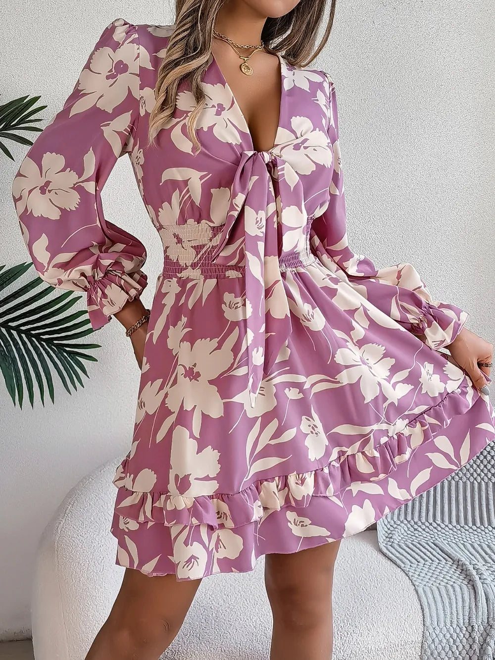 Lilac floral long-sleeve dress with tie-front V-neck and ruffled hemline