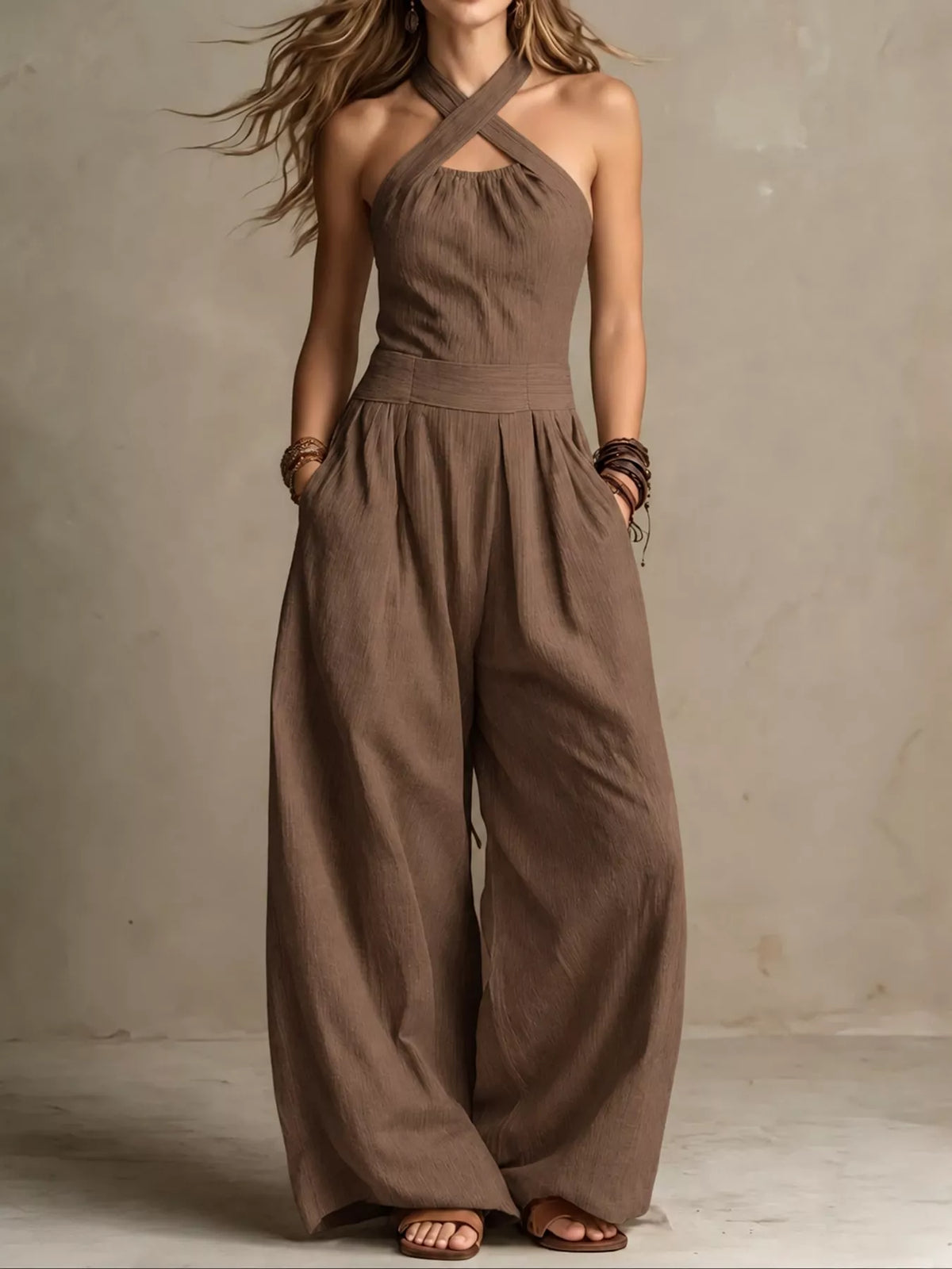 Brown linen halter jumpsuit with high waist and relaxed wide-leg pants