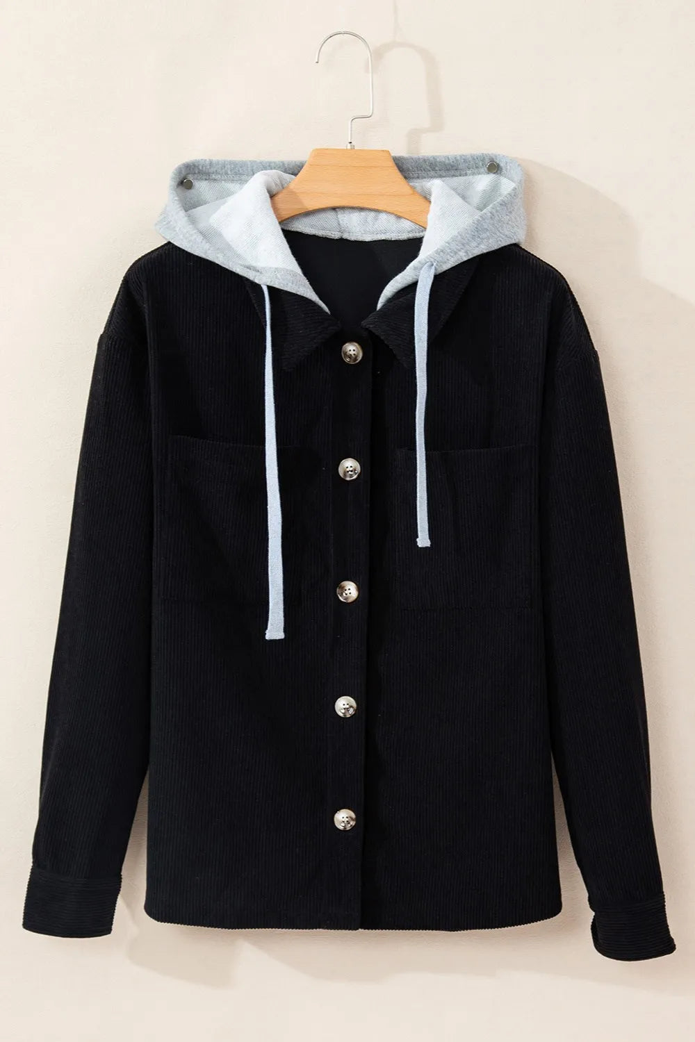 Black hooded button-up jacket with long sleeves, drawstring hood and snap buttons.