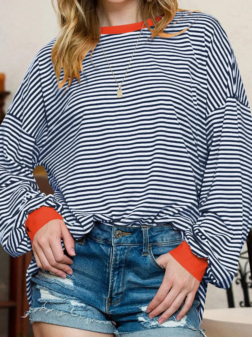 Contrast striped long sleeve sweatshirt in blue and white with orange contrast trim at cuffs