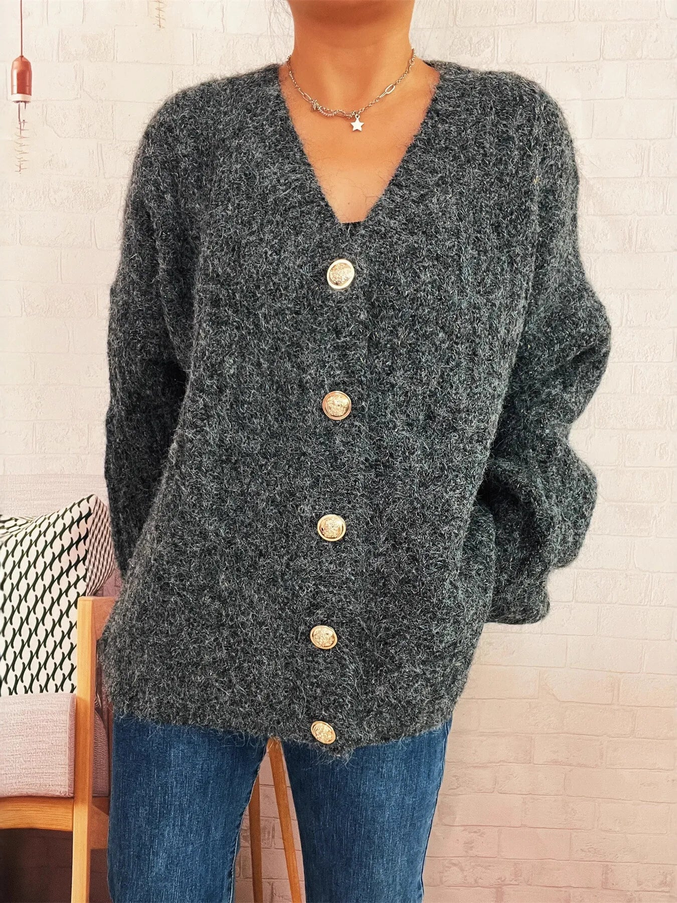 Dark gray cable-knit button-up cardigan with V-neck and round gold-tone buttons