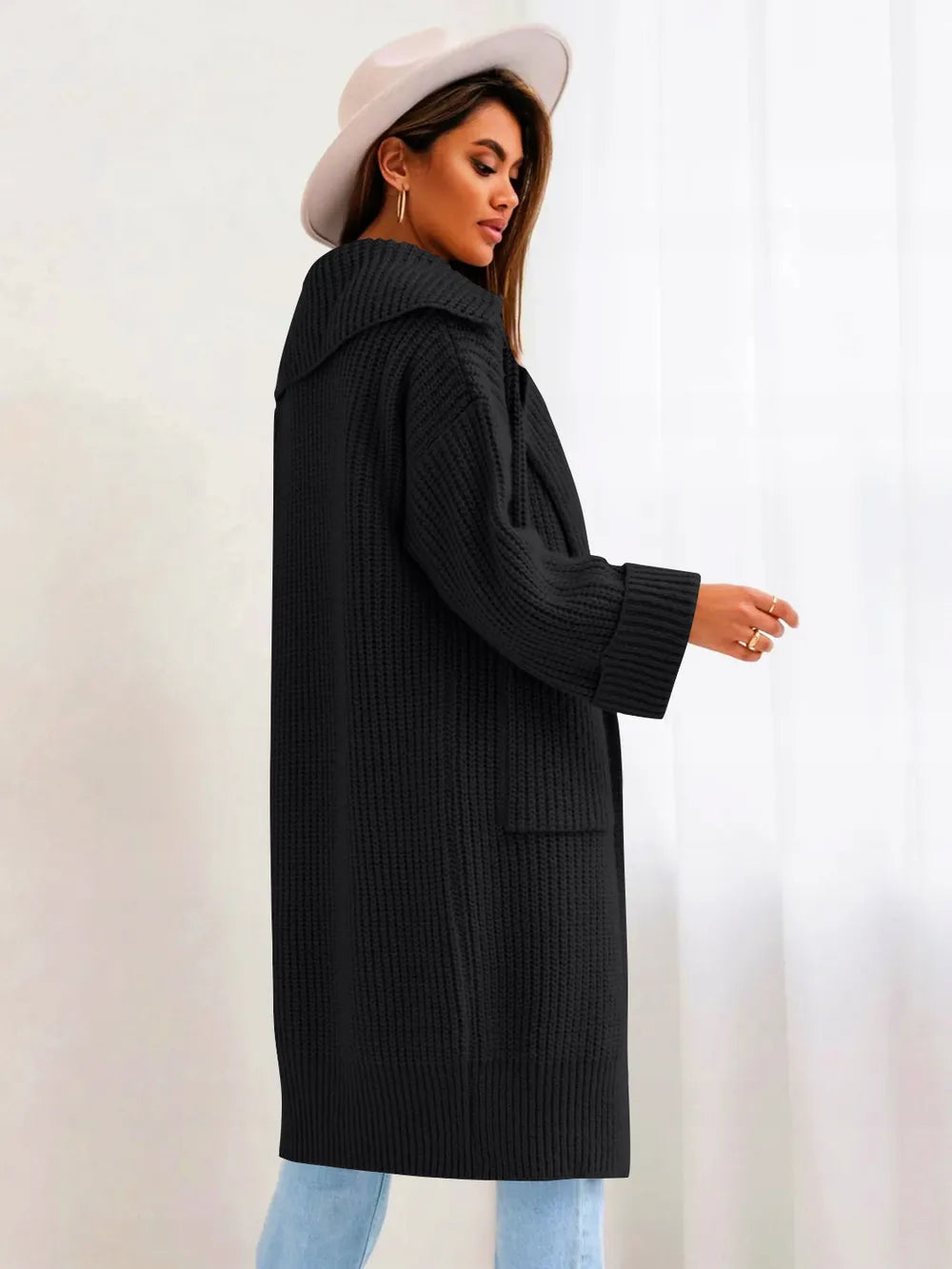 Black collared cardigan with dropped shoulders, ribbed knit, front pockets