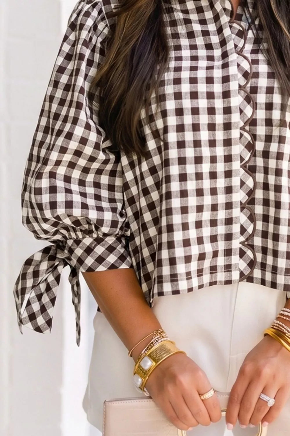 Brown-and-cream gingham tie sleeve shirt close-up with button placket and scalloped trim