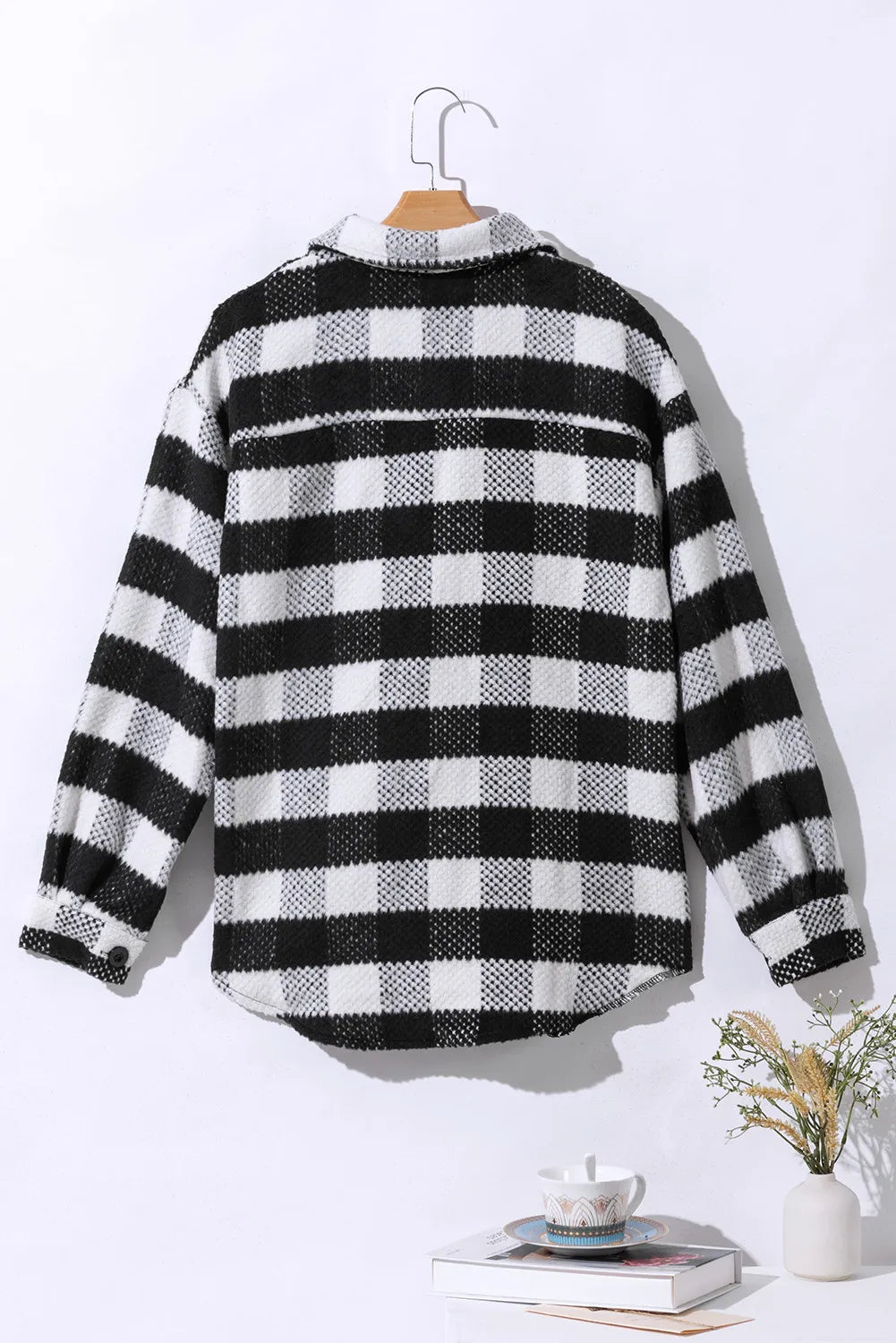 Black-and-white plaid long-sleeve button-up jacket with collar, back view