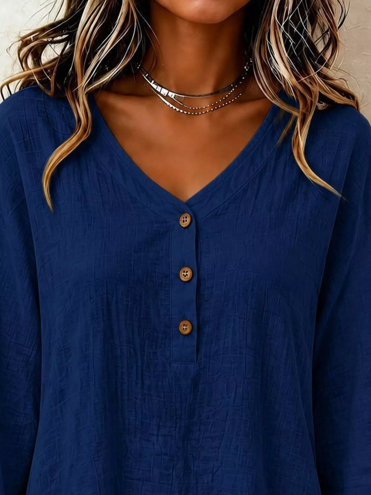 Navy V-neck button-front long-sleeve blouse with wood-look buttons