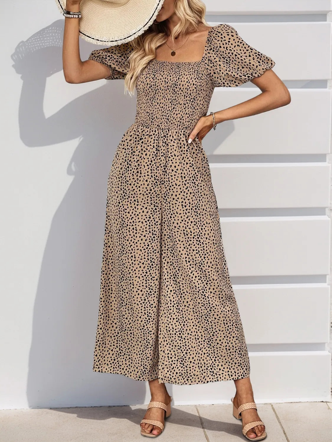 Printed square-neck puff-sleeve jumpsuit, tan speckle pattern, gathered waist, wide-leg fit