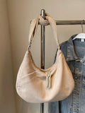 Beige ribbed shoulder bag with adjustable strap and braided tassel pull top