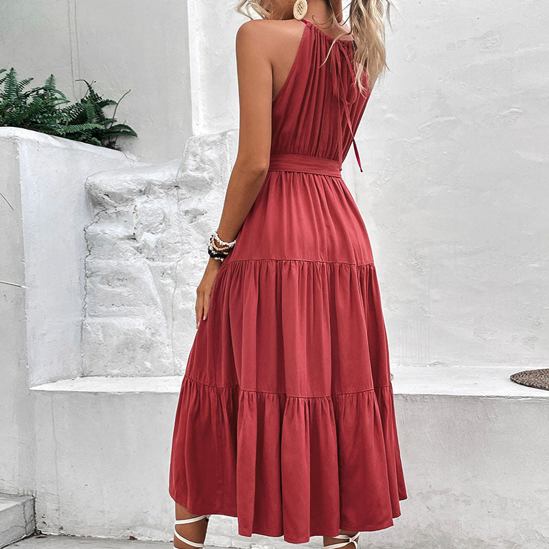 Burgundy halter tiered midi dress with tie belt detail at the waist, sleeveless