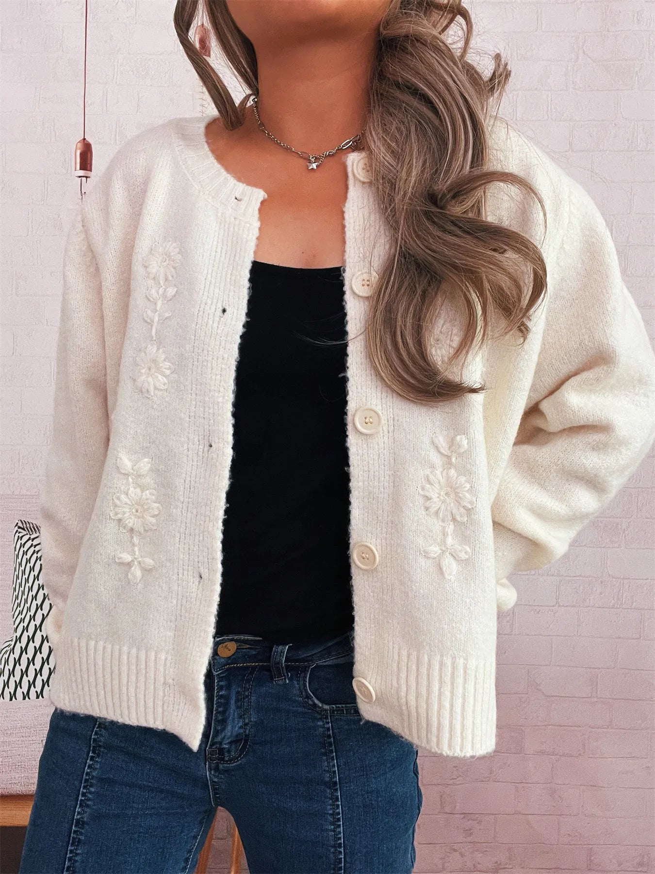 White cardigan with floral embroidery, open front with buttons, ribbed cuffs