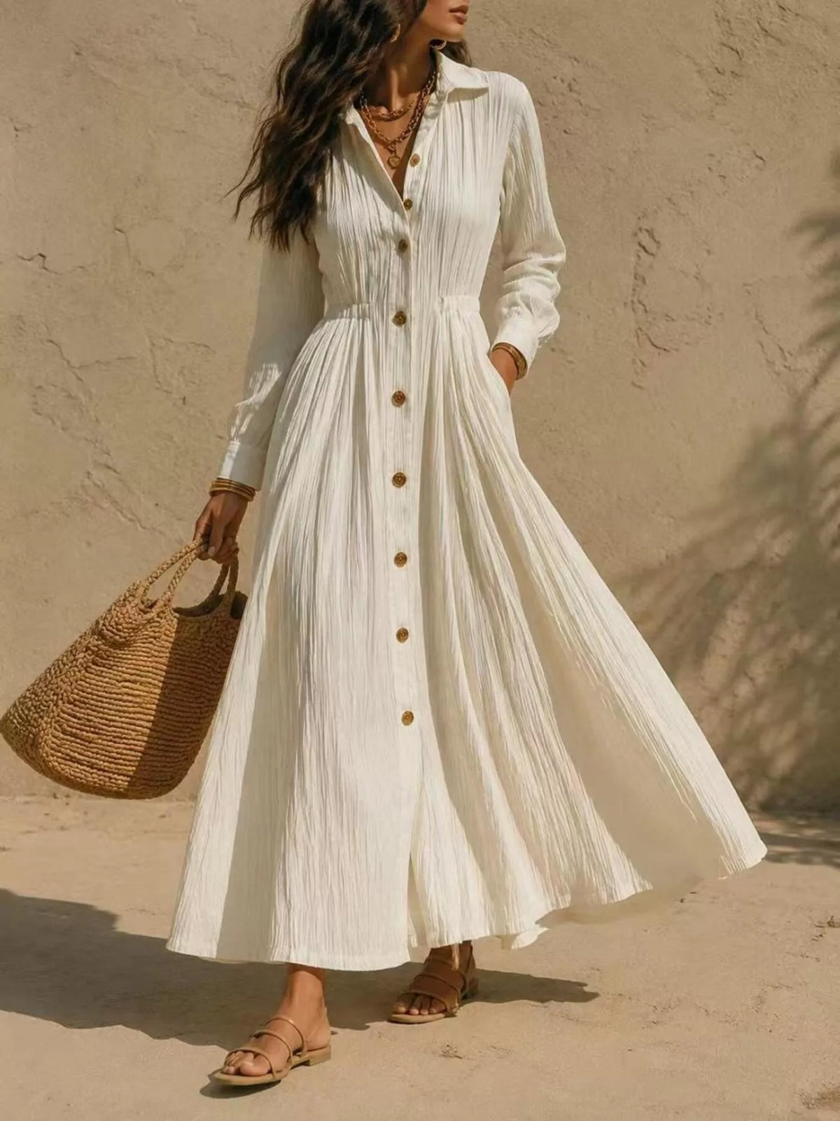 Cream maxi button-front shirtdress with textured fabric, long sleeves, and gathered waist
