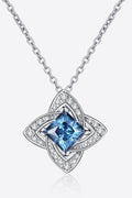 Silver-tone floral pendant necklace with sky-blue moissanite center and halo stones