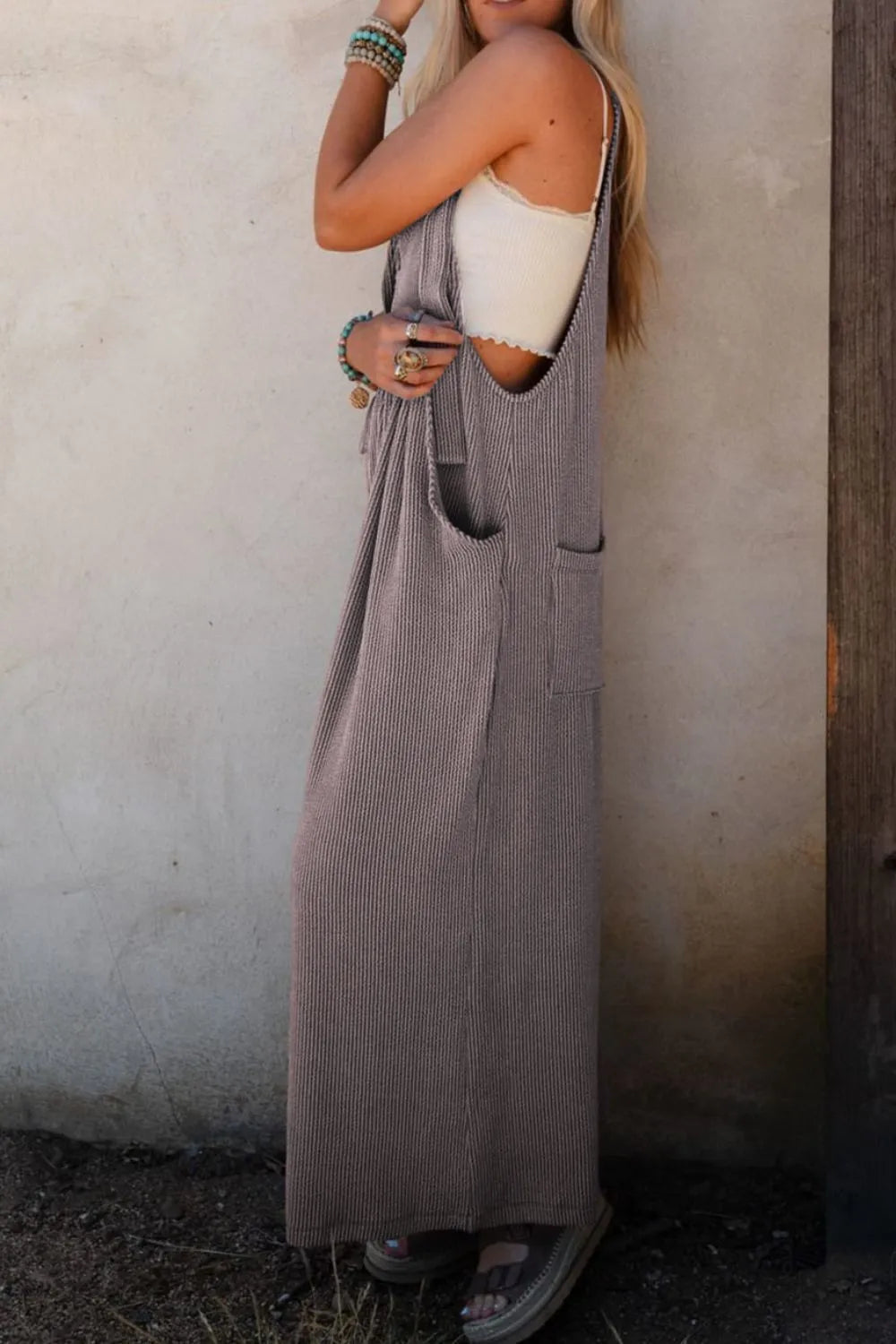 Corded adjustable-strap wide-leg overalls, dark with light pinstripes, side pockets