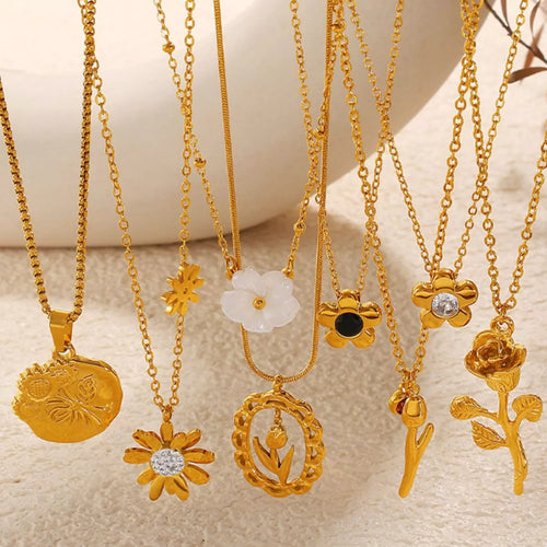 Gold-tone pendant necklaces with assorted flower charms on chain links