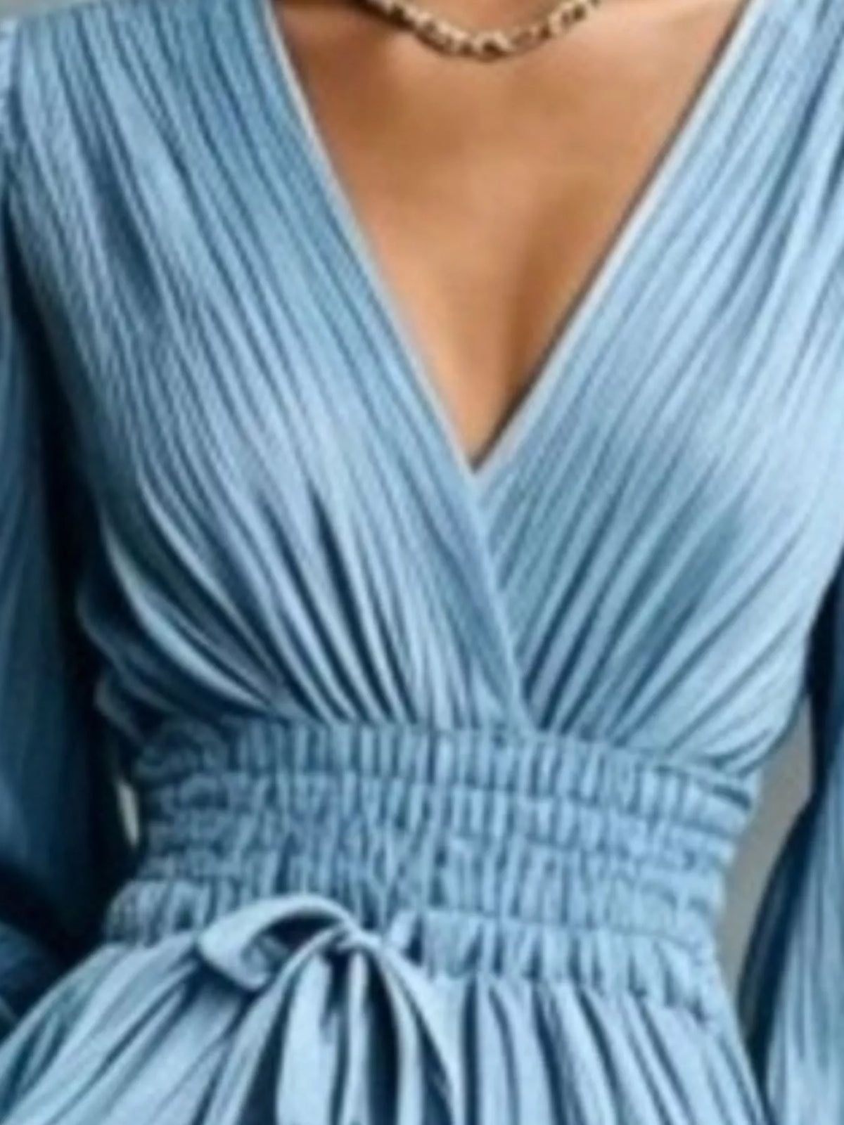 Sky blue V-neck tie-waist pleated maxi dress close-up with bow detail