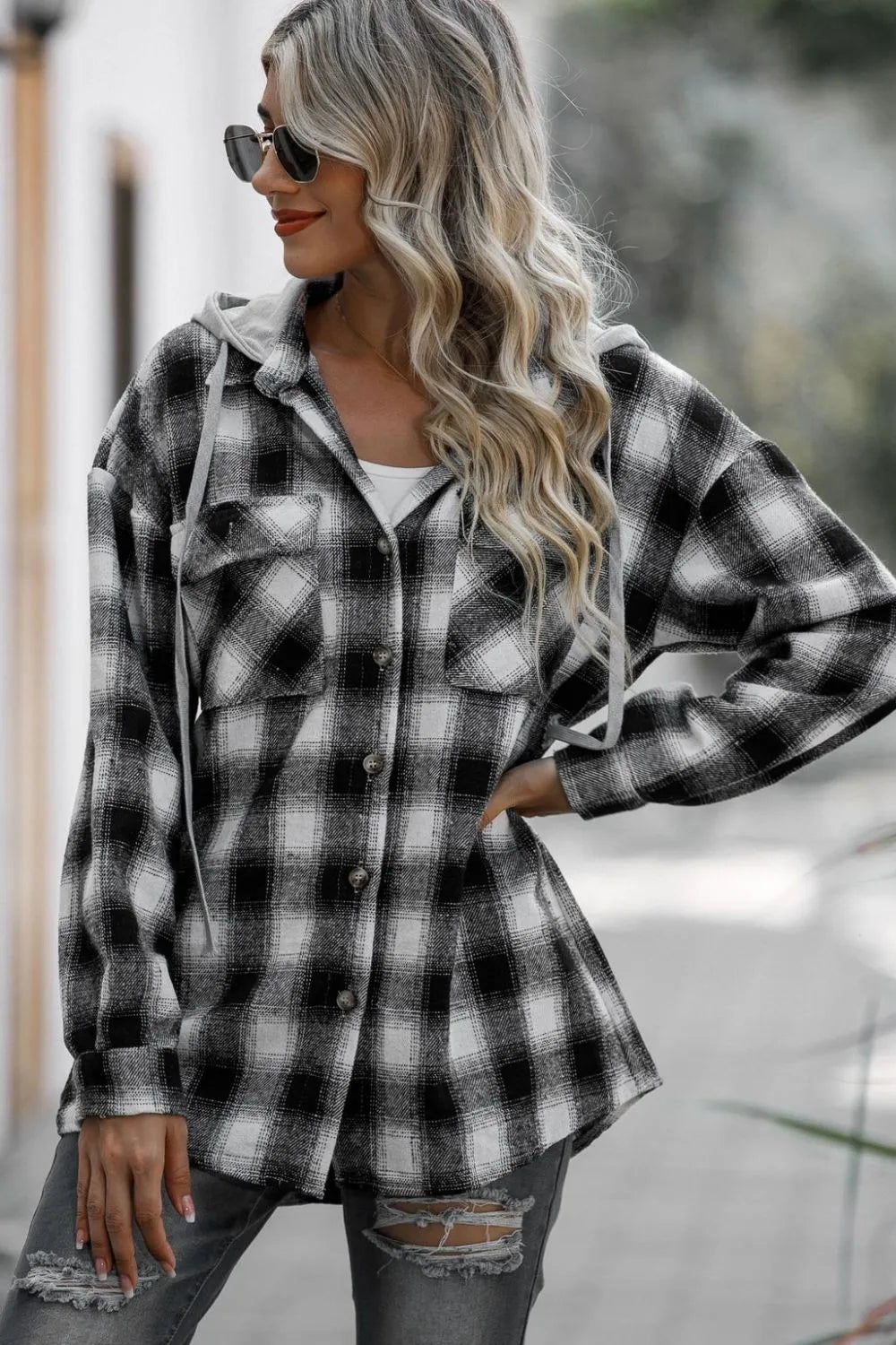 Black-and-gray plaid hooded shacket with button front and drawstring hood, long sleeves