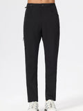 Men's slim-fit stretch casual pants in black, front view with belt loops and pockets
