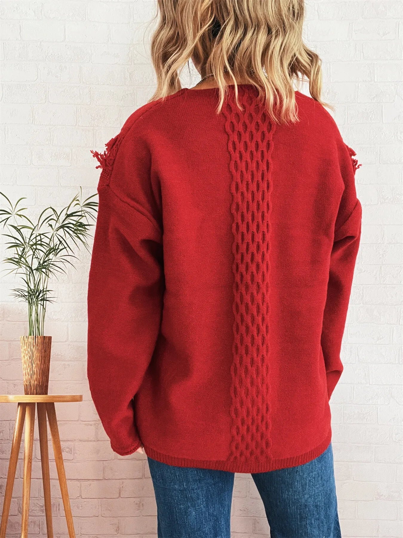 Burgundy cable knit back sweater with lace-up neckline and frayed shoulder hem