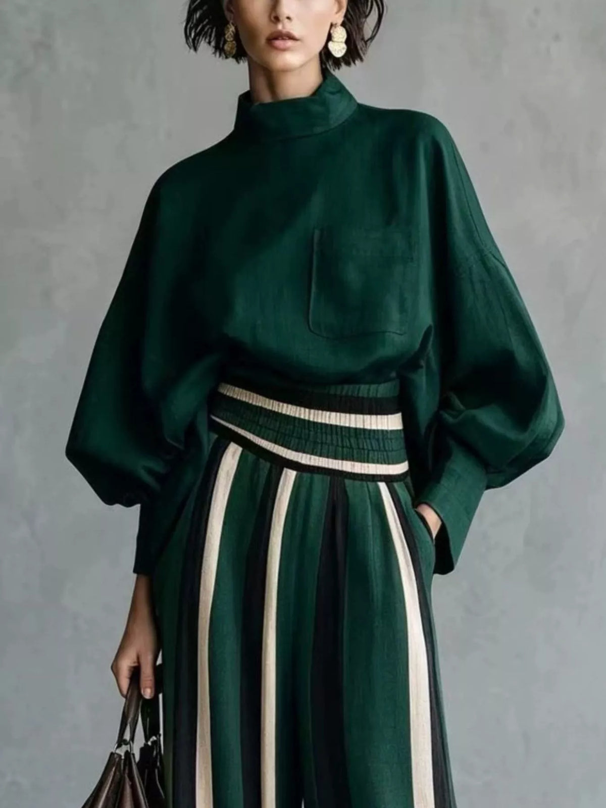 Dark green mock neck long-sleeve top with striped wide-leg pants and ribbed waistband