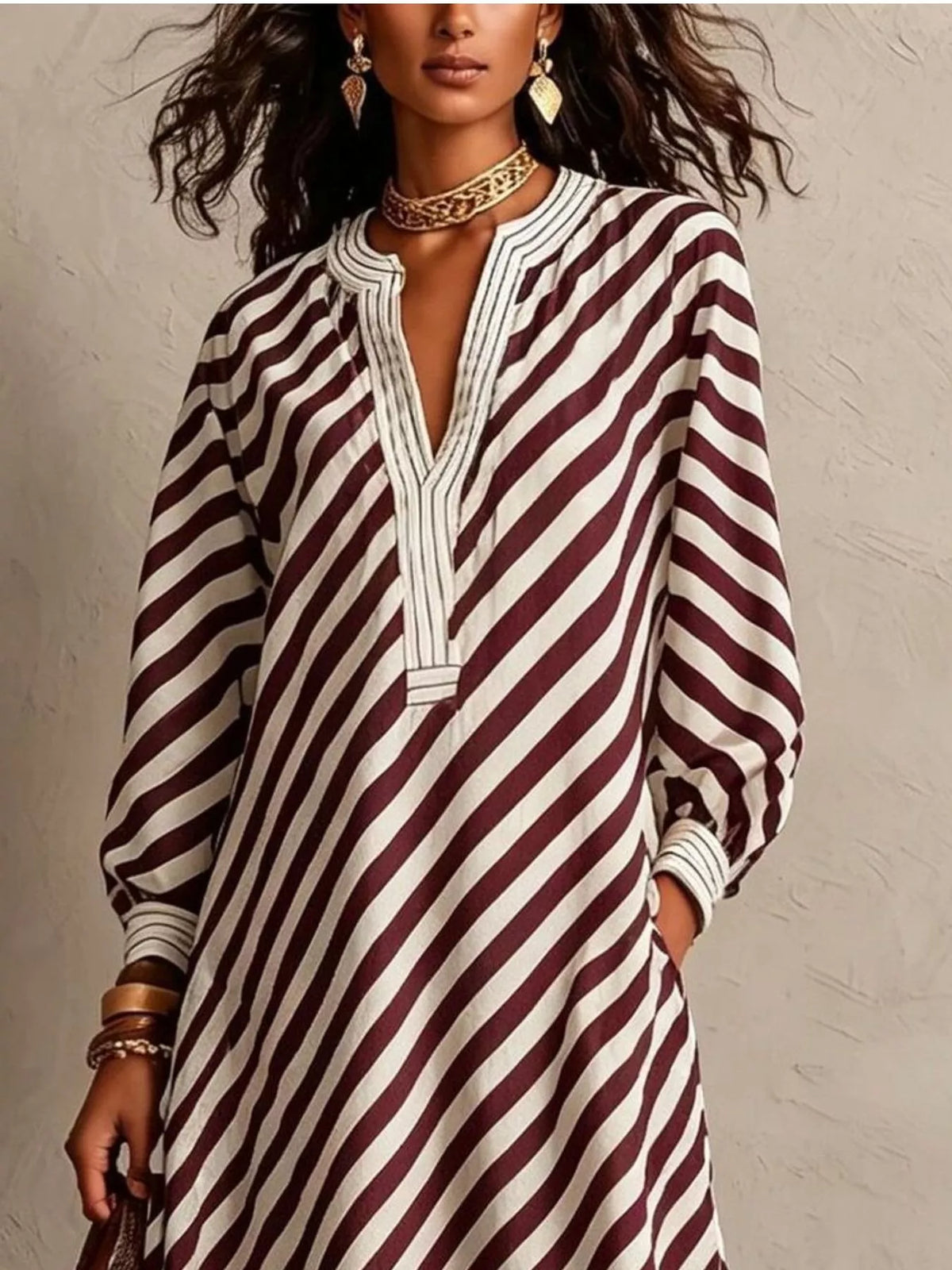 Burgundy-and-white striped maxi dress detail, V-neck and long balloon sleeves