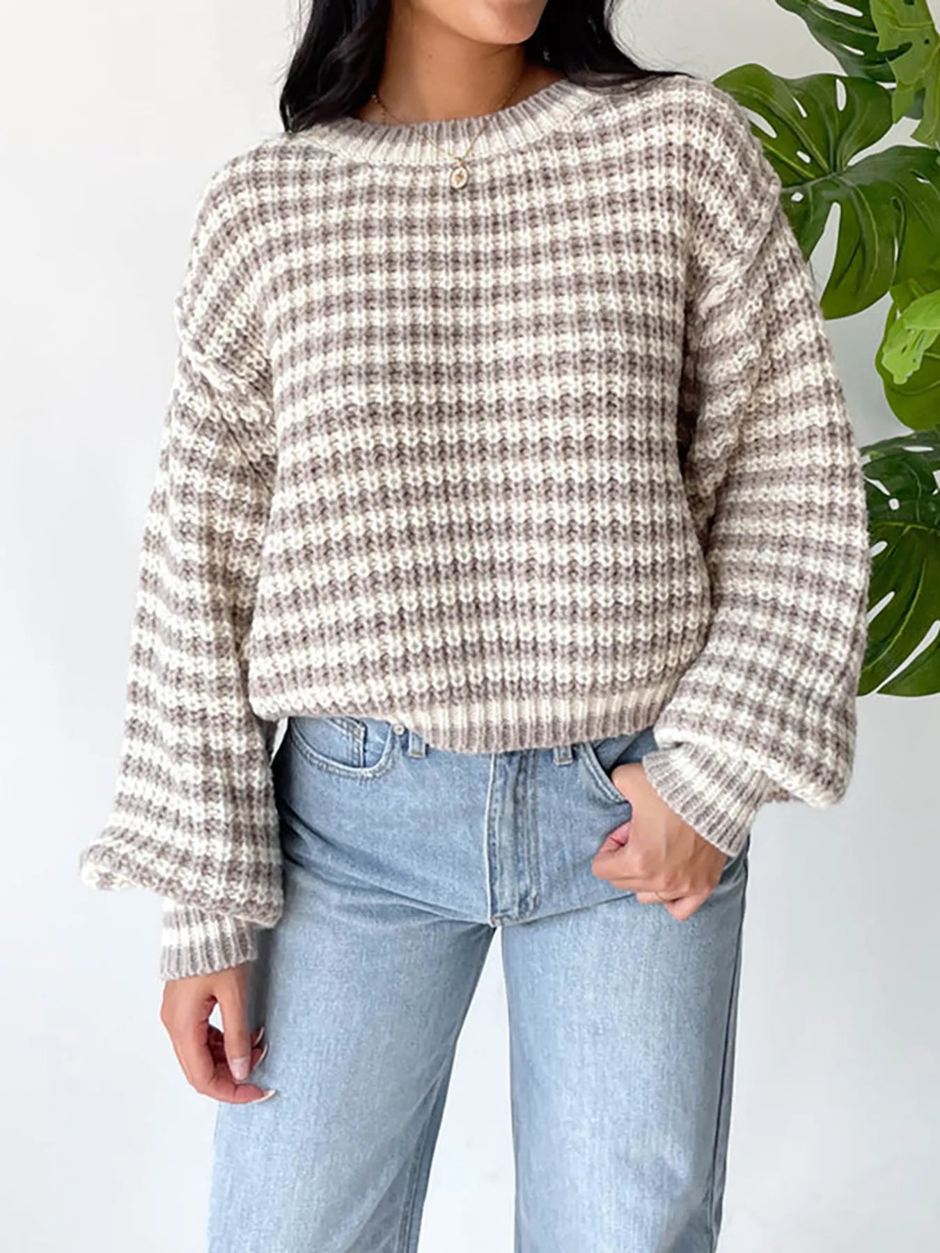 Oversized drop-shoulder knit sweater with crew neck and taupe-and-dark stripe pattern