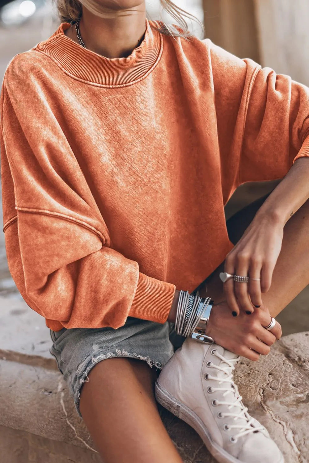 Orange mock neck dropped-shoulder sweatshirt with ribbed collar and cuffs