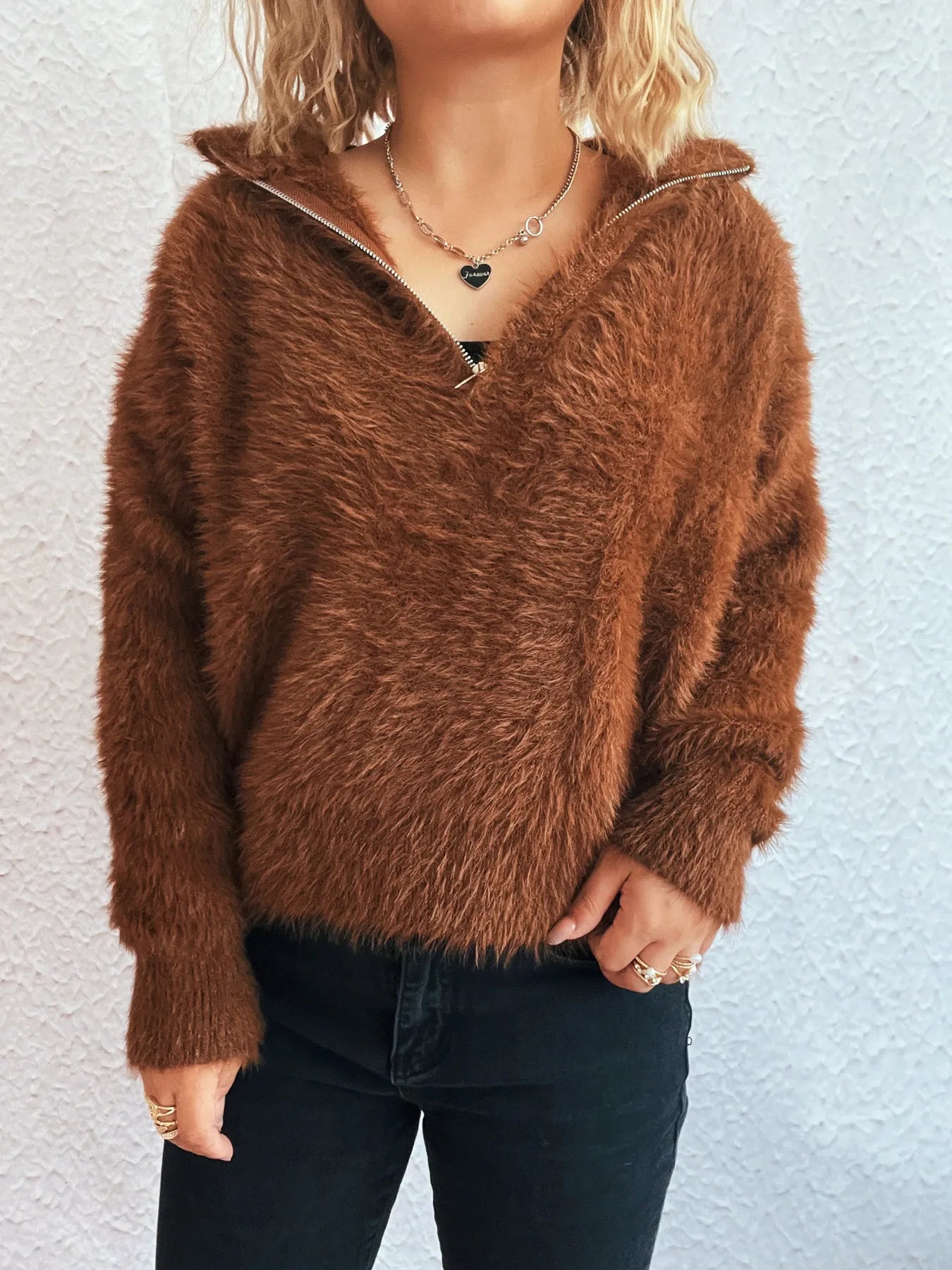 Brown fuzzy half-zip sweater with long sleeves and V-neck placket