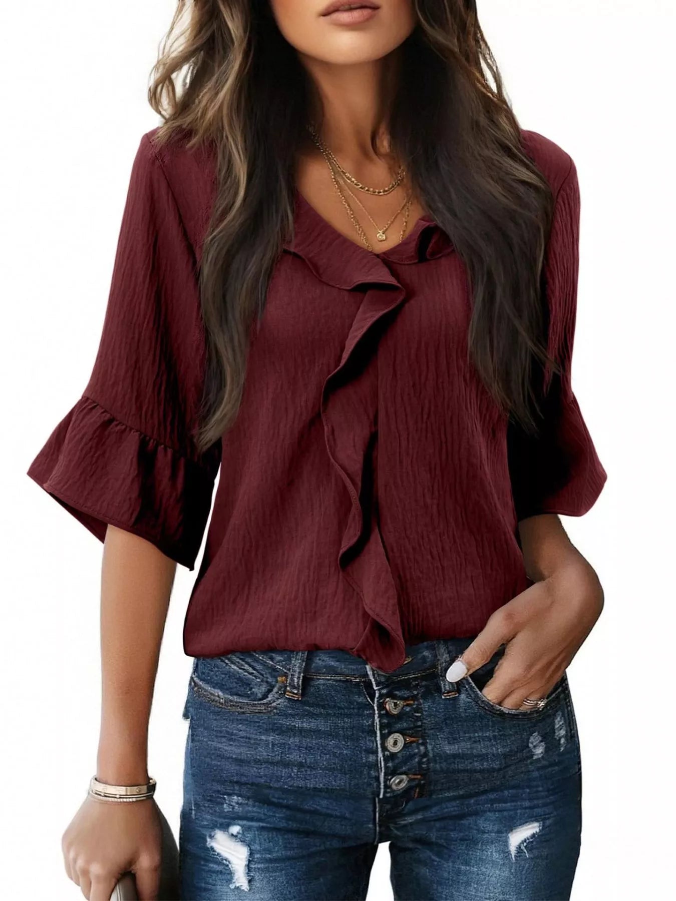 Burgundy ruffle-trim V-neck blouse with layered ruffle neckline and flared sleeves.