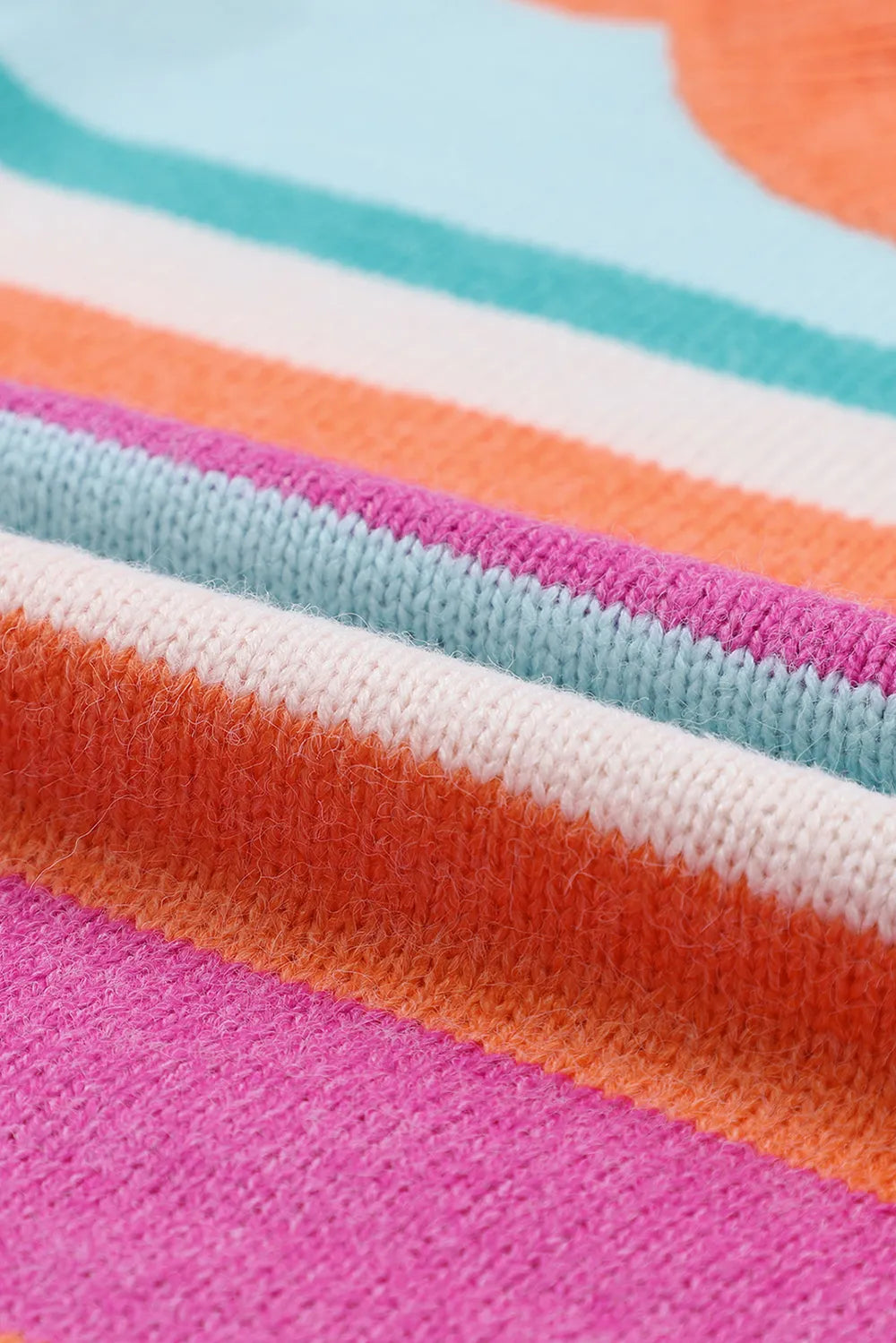 Striped knit sweater with magenta fabric and teal, orange, and white stripes