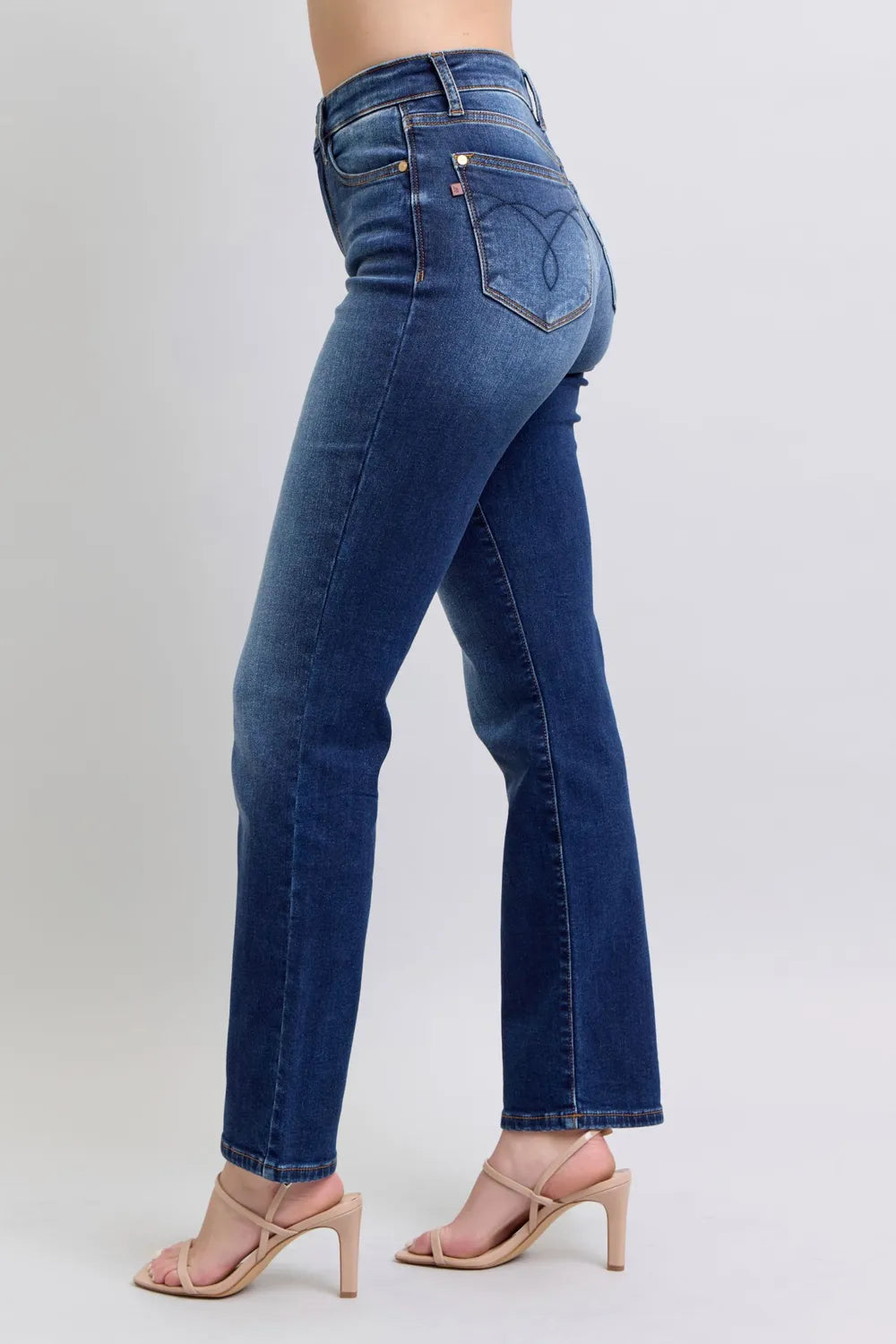 Washed dark blue straight-leg jeans with back pockets and curved yoke seam