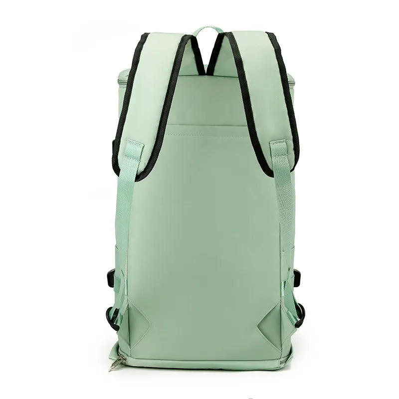 Mint green large travel backpack with adjustable shoulder straps and side compression buckles.