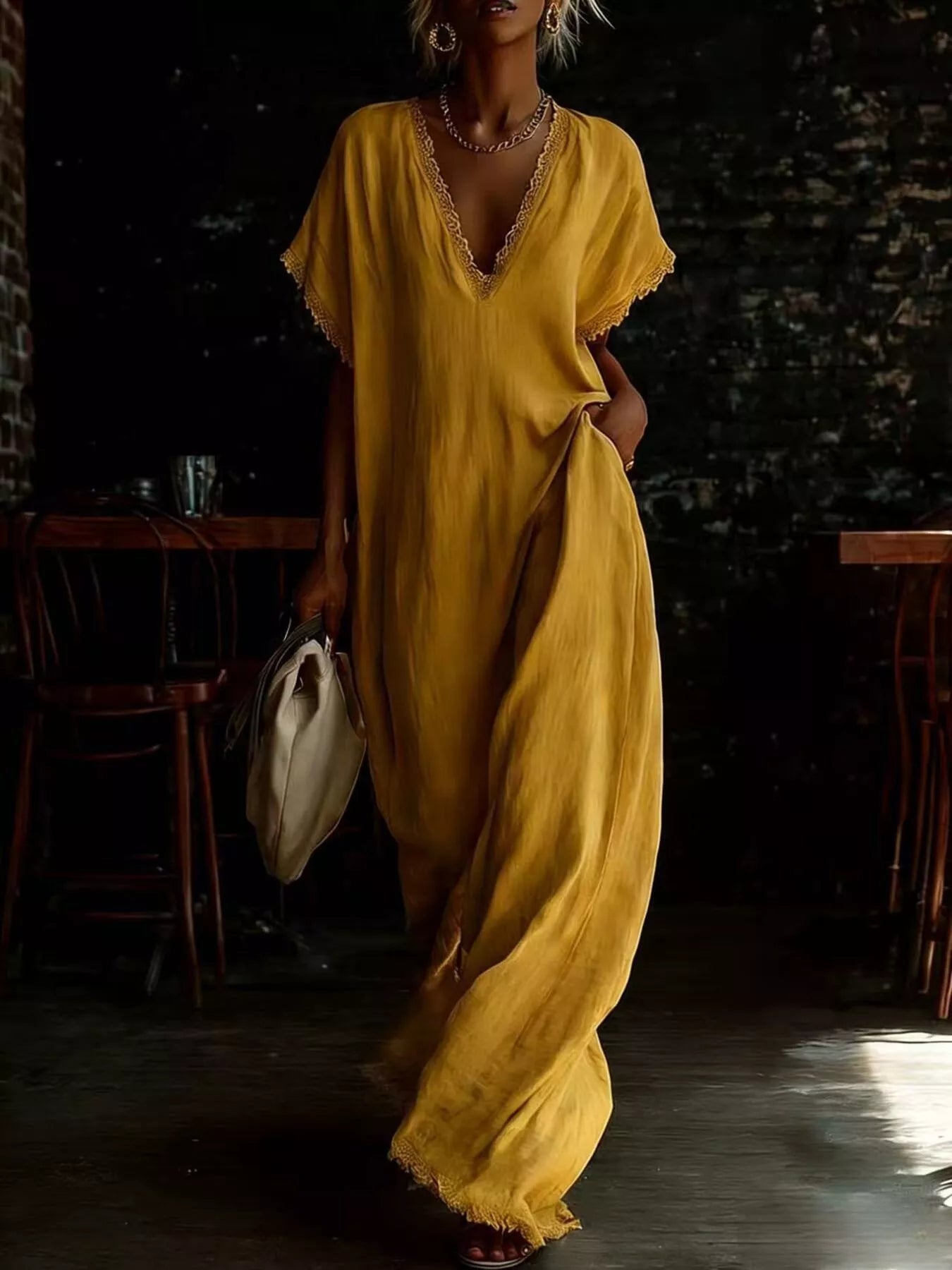 Yellow lace-trim V-neck maxi dress with short sleeves and loose floor-length shape.