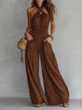 Brown halter neck smocked jumpsuit with wide legs and front pockets