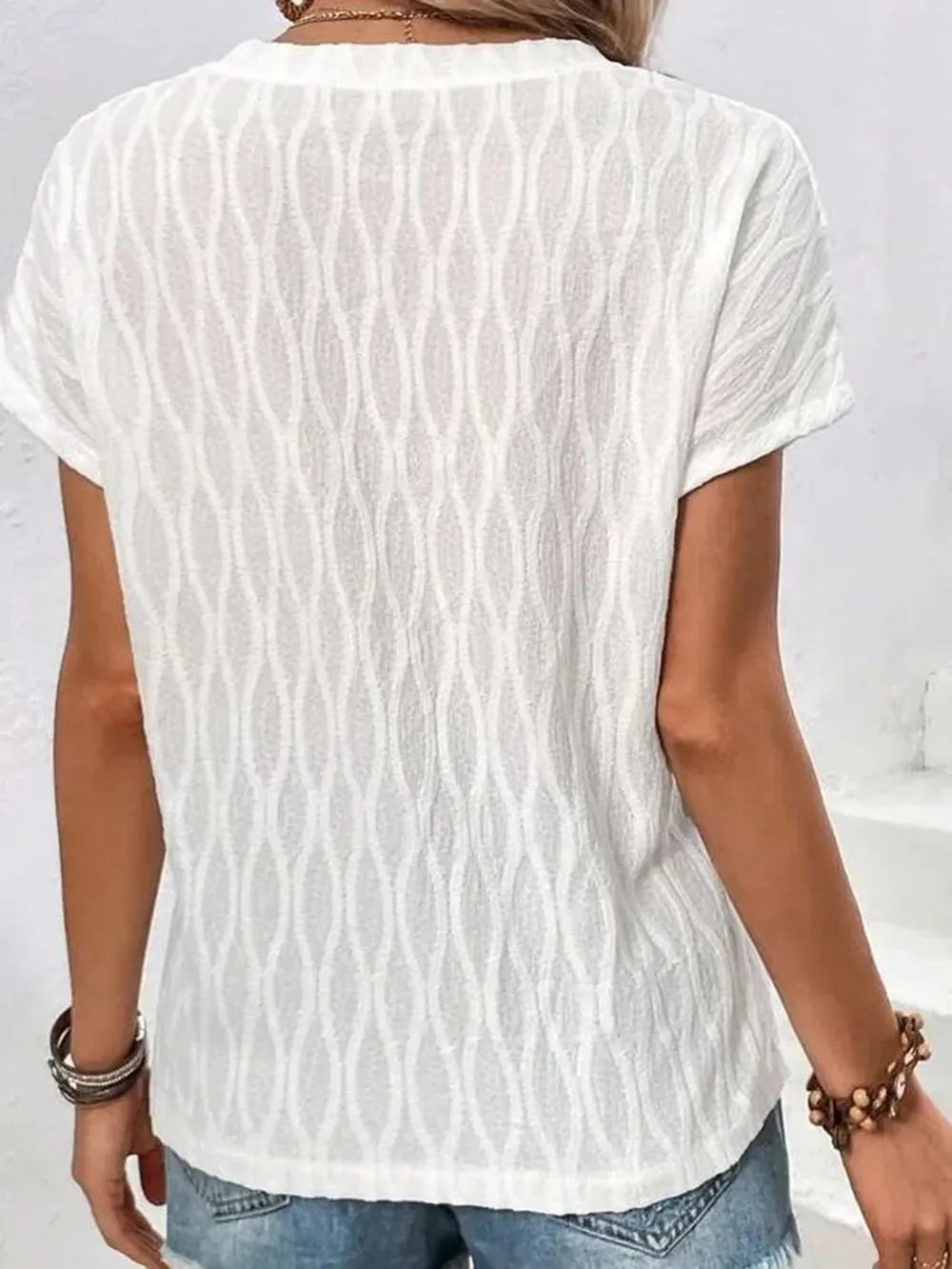 White patterned short-sleeve T-shirt, round neck, back view