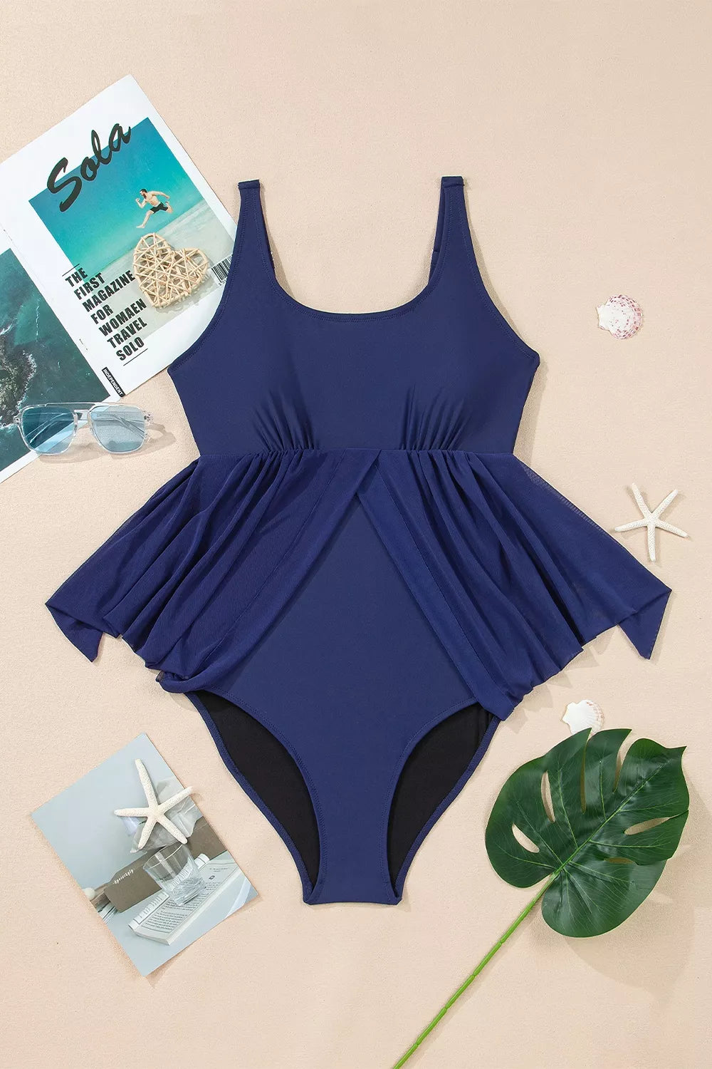 Navy V-neck one-piece swimsuit with draped bodice and high-cut leg