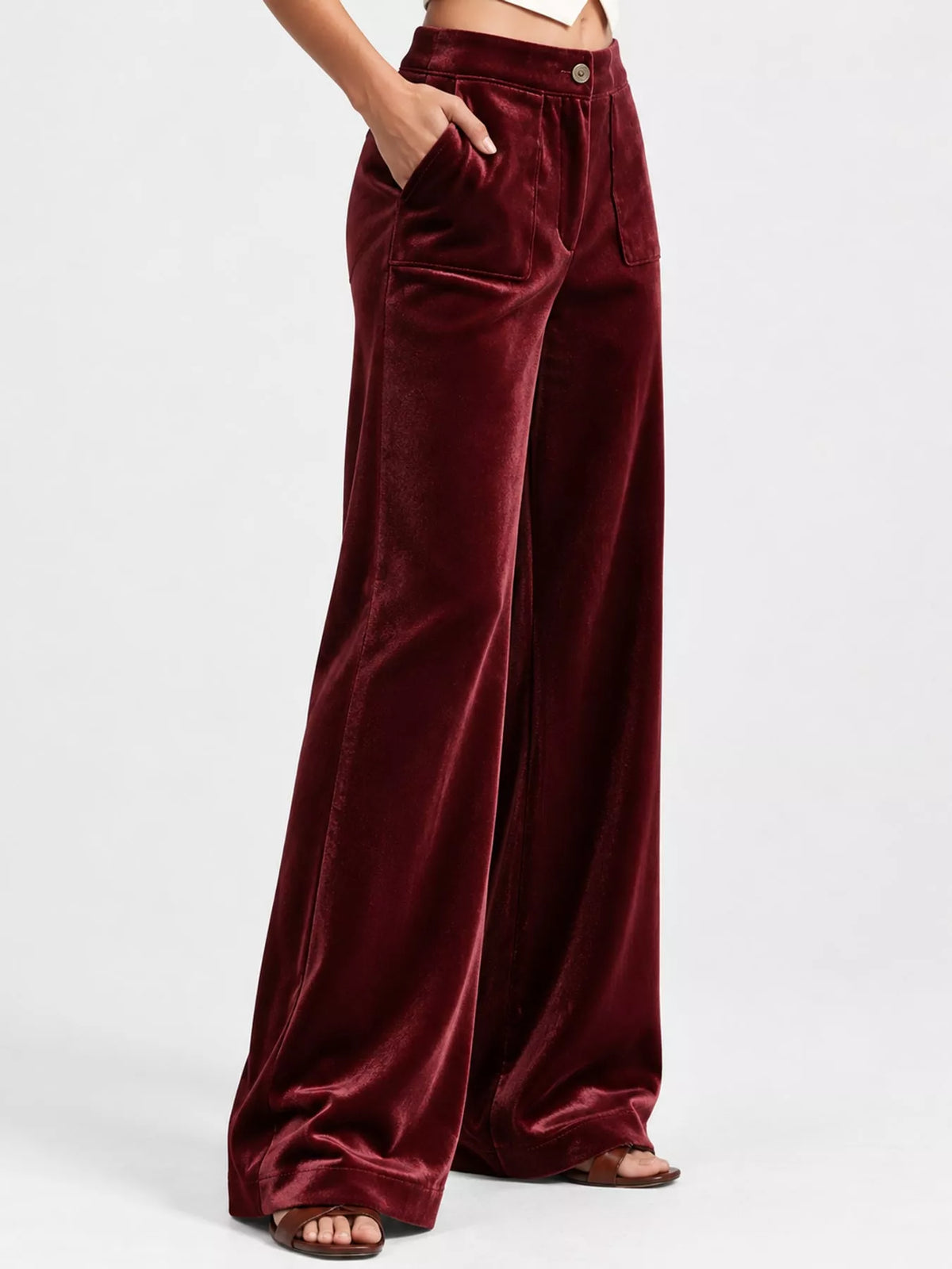 Wine red velvet high-waisted wide-leg pants with front pockets and button closure