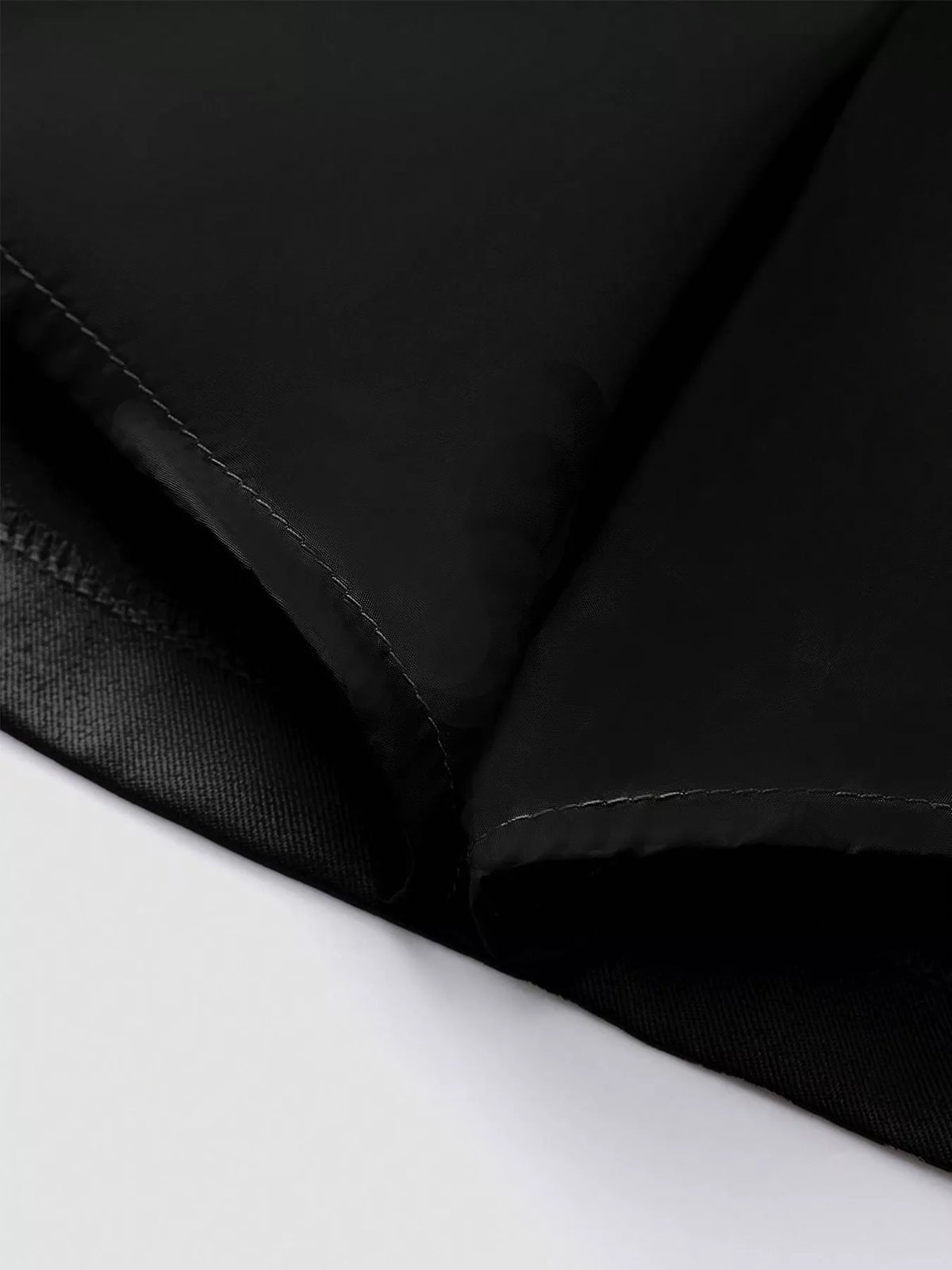 Black skirt hem and inner seam with neat stitching