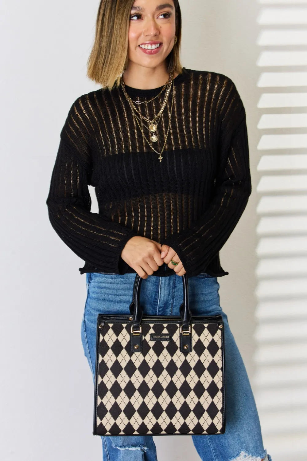 Argyle-pattern PU leather handbag, cream-and-black diamond print, top handles with studs