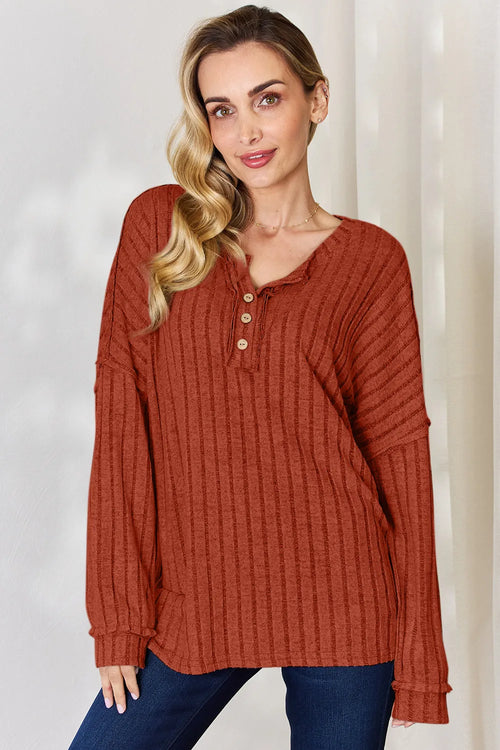 Ribbed half-button long sleeve T-shirt, rust V-neck with front buttons.