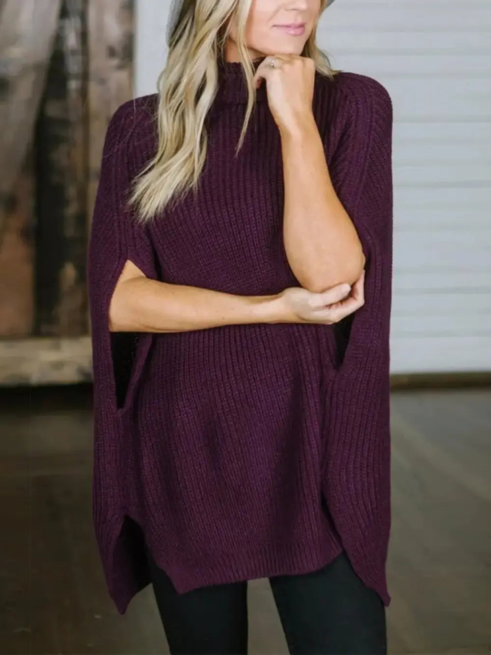 Burgundy turtleneck slit sweater with chunky rib knit and side slit detail.