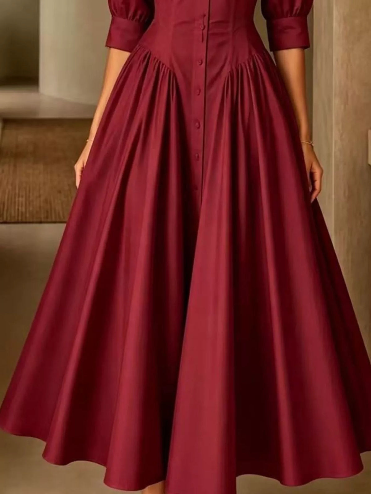 Burgundy button-down shirt dress with cinched waist and wide gathered skirt with button front.