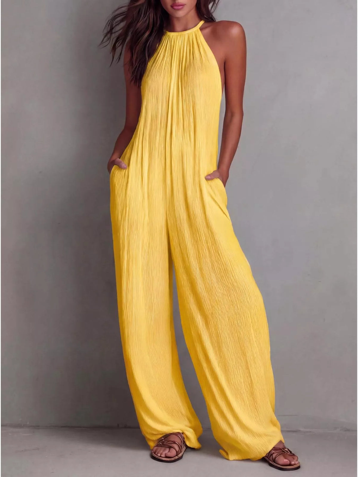 Sleeveless wide-leg jumpsuit in yellow, halter neckline with pleated drape, wide pants