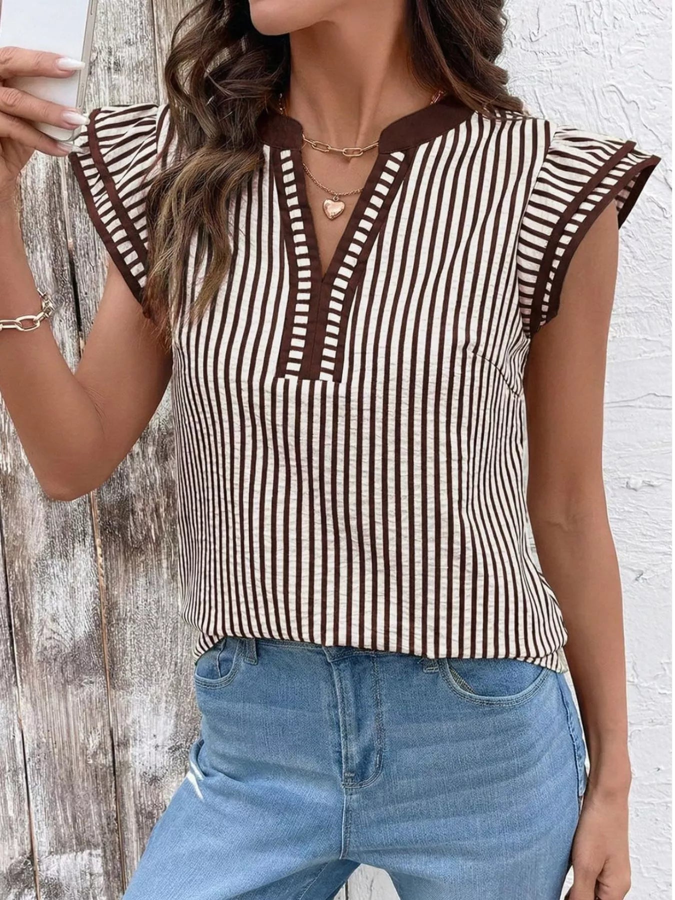 Striped ruffle sleeve blouse by Trendsi in brown and white with V-neck and brown trim.