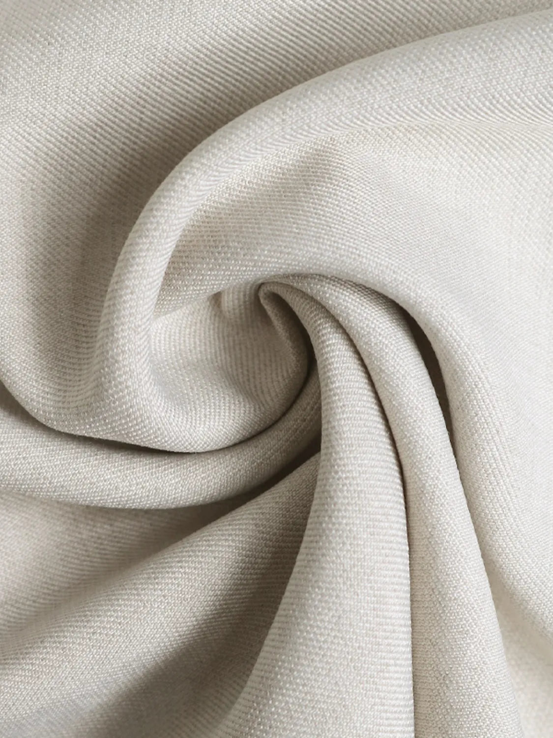 Beige textured fabric drape from wide-leg pleated pants